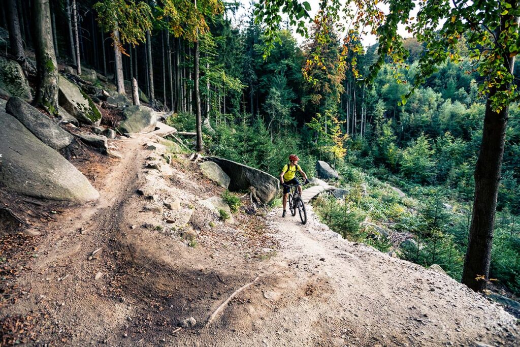 Mountain biker riding on bike in and around Vail