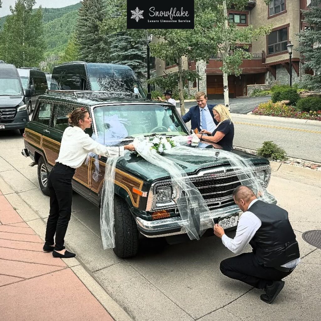 Luxury chauffeur team standing beside black Cadillac SUV and Mercedes Sprinter van